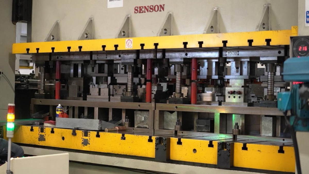 Progressive die stamping press