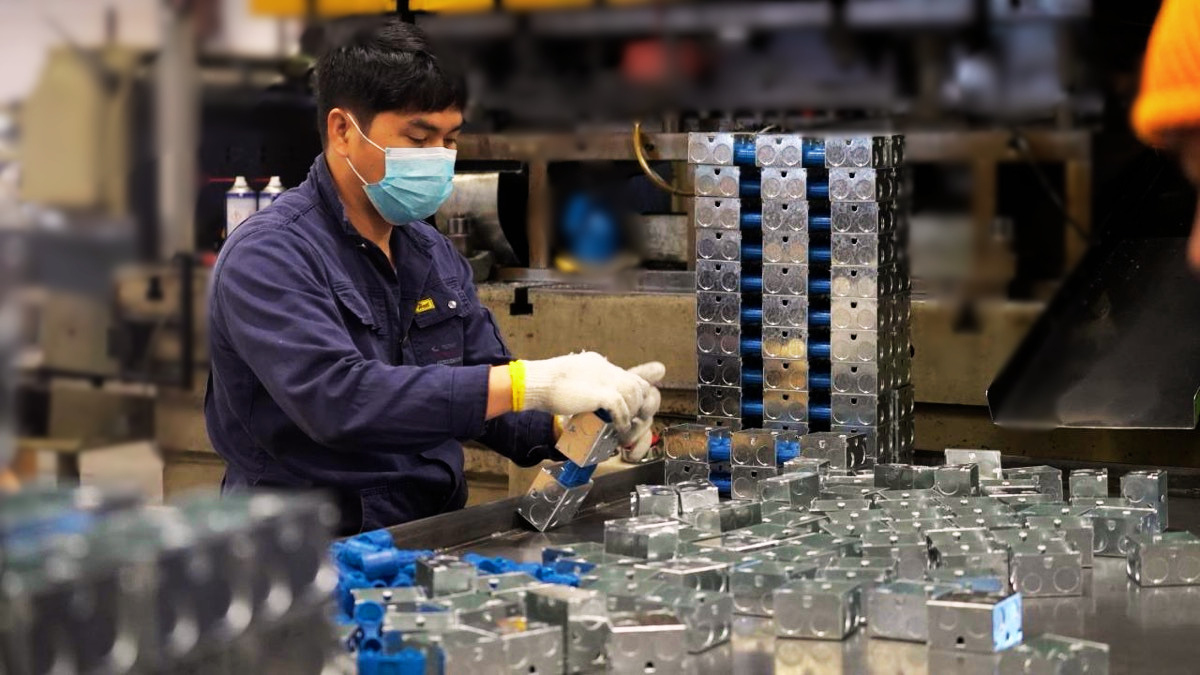Worker performing quality check